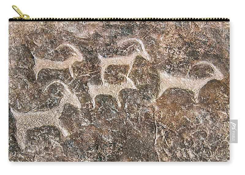 Petroglyph Zip Pouch featuring the photograph Desert Petroglyphs by Anthony Sacco