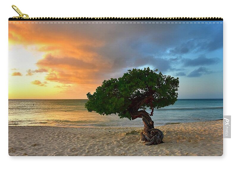 Tree Zip Pouch featuring the photograph Divi Divi Tree at sunset by Monika Salvan