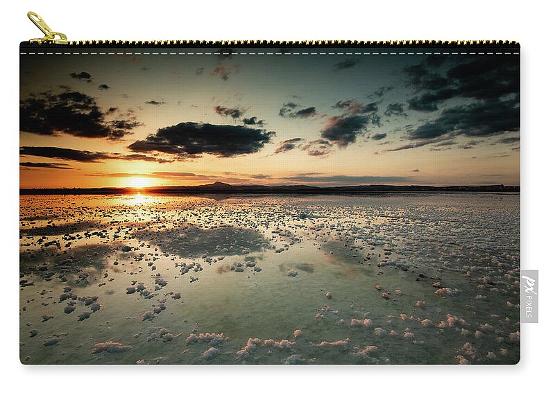 Sunset Carry-all Pouch featuring the photograph Dramatic winter sunset in the lake. by Michalakis Ppalis