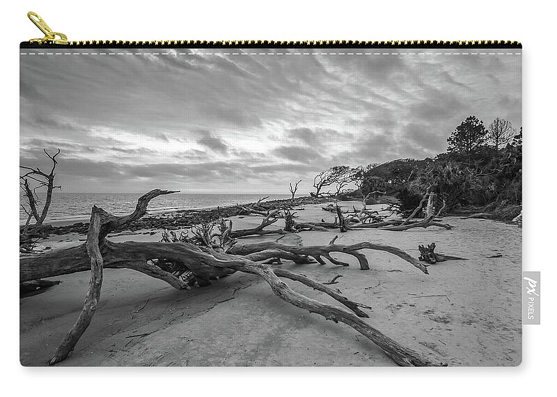 3-nature Zip Pouch featuring the photograph Drift wood beach photograph by Louis Dallara