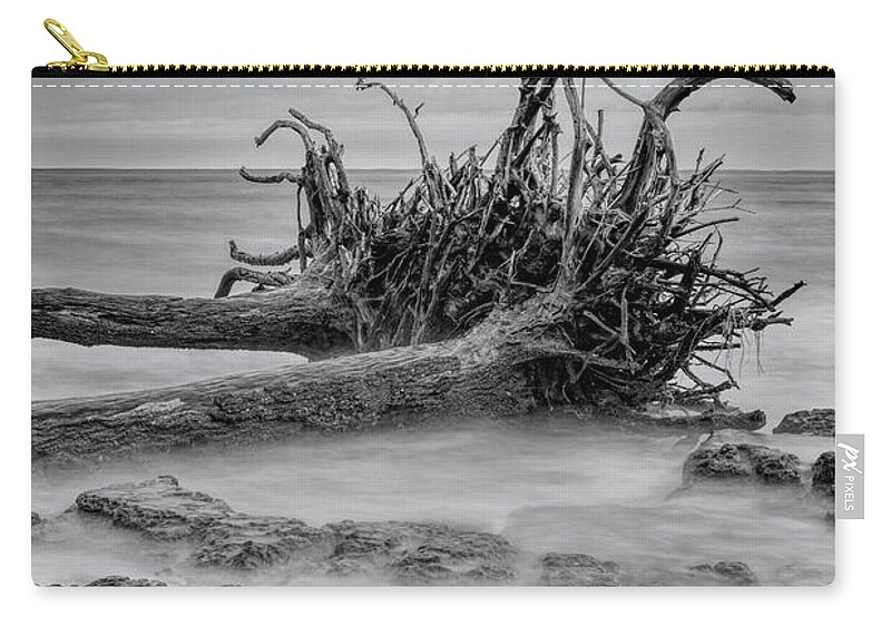 Black Carry-all Pouch featuring the photograph Driftwood Beach in Black and White by Carolyn Hutchins