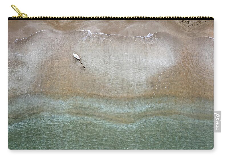 Animal Running Carry-all Pouch featuring the photograph Drone aerial of white Dog running and playing at empty sandy beach by Michalakis Ppalis