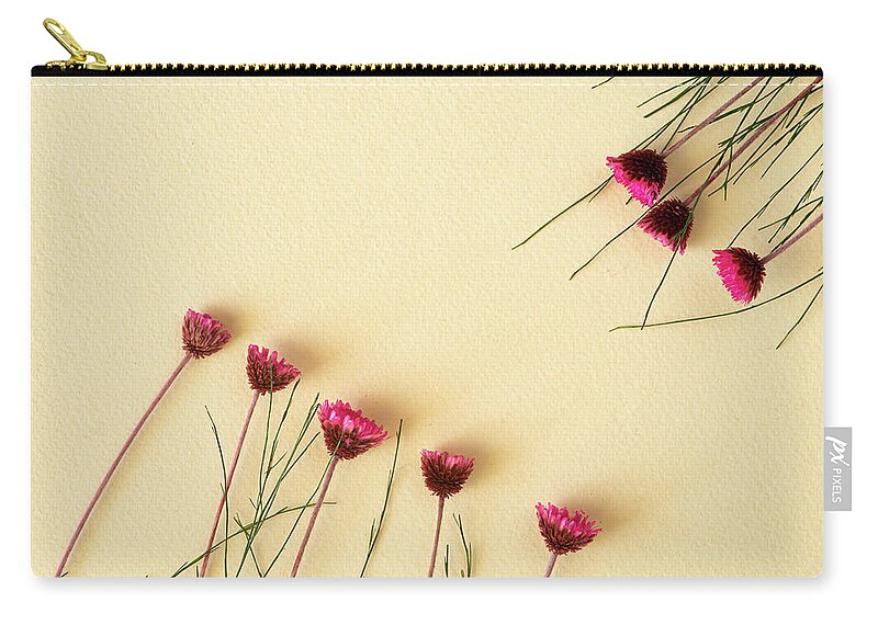 Dry Flowers Zip Pouch featuring the photograph Dry purple floral bouquet on yellow background. Flat lay, top vi by Michalakis Ppalis