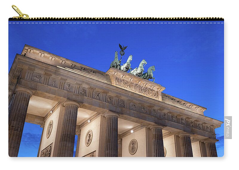 Berlin Zip Pouch featuring the photograph Dusk At Brandenburg Gate In Berlin by Artur Bogacki