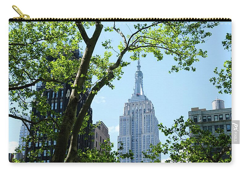 New York Zip Pouch featuring the photograph Empire state building from Bryant Park by Alberto Zanoni