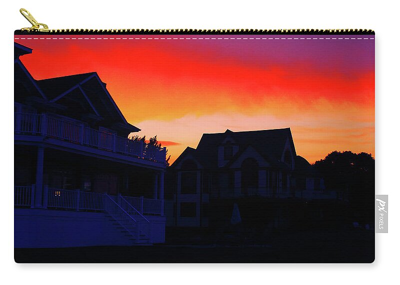Scenic Zip Pouch featuring the photograph Fire in the Sky by Jim Feldman