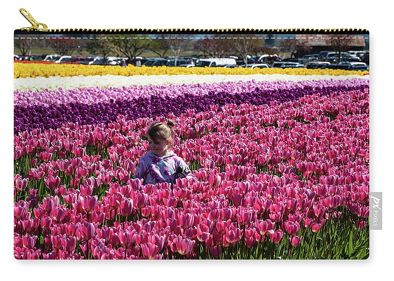 Flower Among The Tulips Zip Pouch featuring the photograph Flower Among the Tulips by Tom Cochran