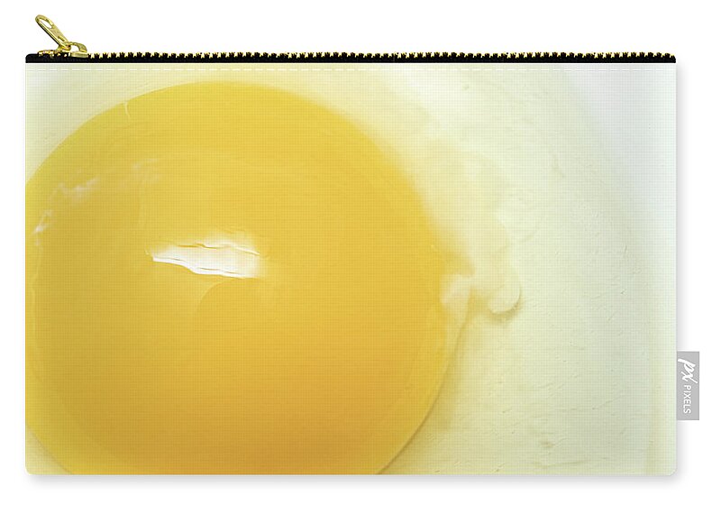Food Zip Pouch featuring the photograph Food Photography - Egg Yolk by Amelia Pearn