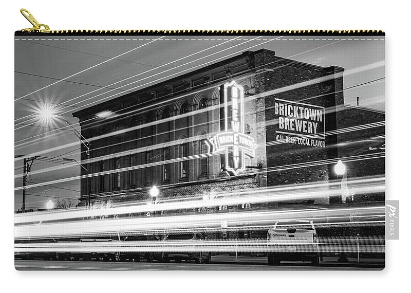 Fort Smith Zip Pouch featuring the photograph Fort Smith Light Trails And Brewery Neon - Monochrome Panorama by Gregory Ballos