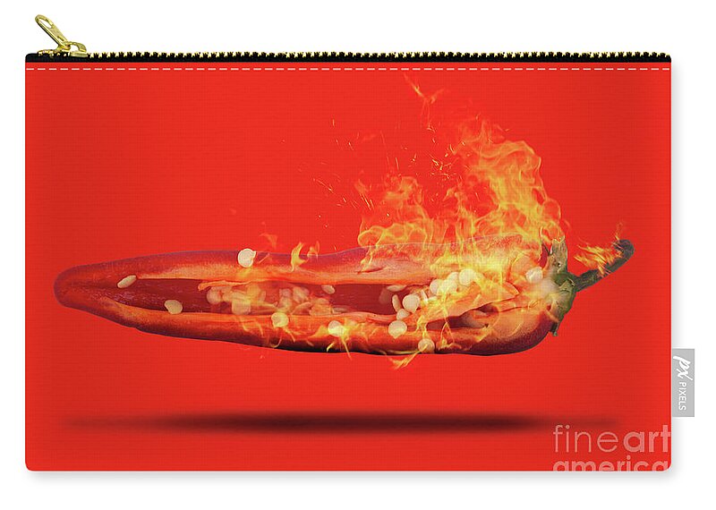 Red Zip Pouch featuring the photograph Half a red chili pepper on fire with seeds by Simon Bratt