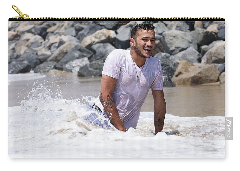 Man Zip Pouch featuring the photograph Happy young man enjoying the beach by Mark Stout