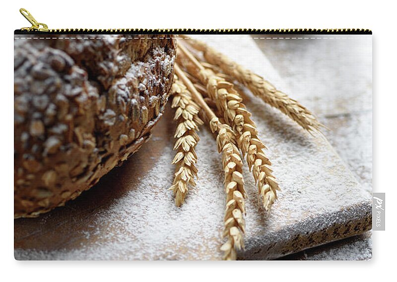 Bread Zip Pouch featuring the photograph Homemade bread with cereals by Jelena Jovanovic