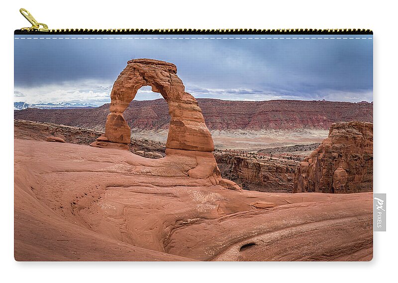 Arches National Park Zip Pouch featuring the photograph Iconic Delicate Arch by Andy Konieczny