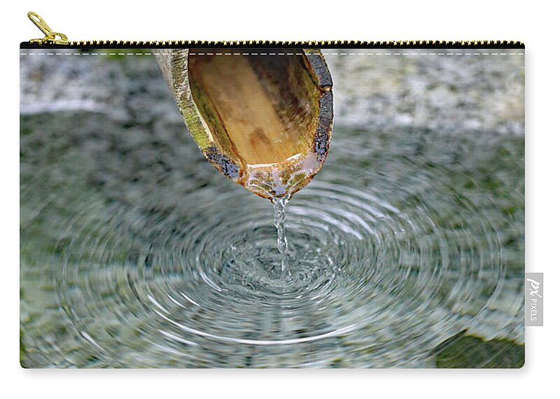 Water Fountain; Fountain; Japanese Fountain; Japanese Garden; Zen; Water; Drip; Droplets; Bamboo; Pool; Stone; Pebbles; Green; Zip Pouch featuring the photograph In a Japanese Garden by Tina Uihlein