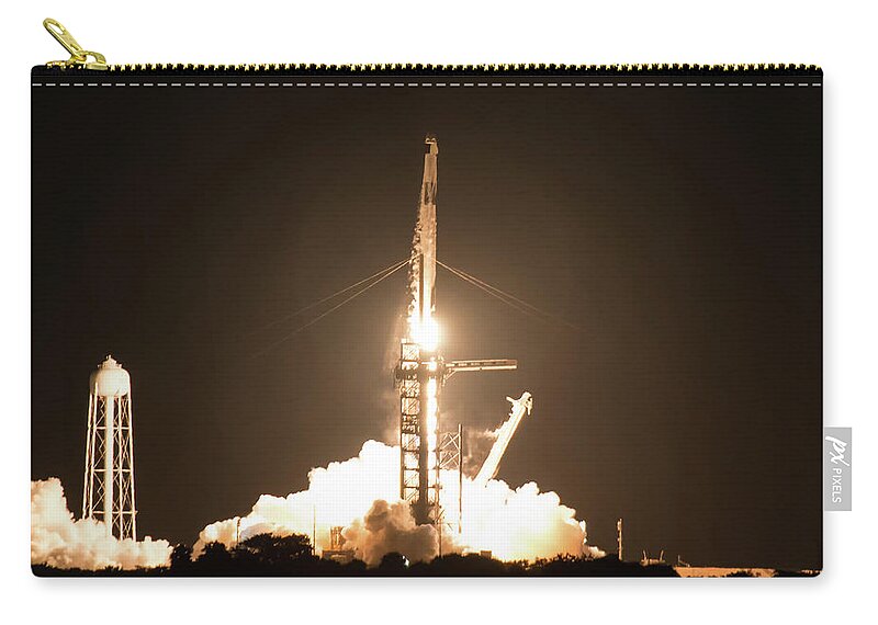 Merritt Zip Pouch featuring the photograph Inspiration 4 Lift Off 2 - Resilience and its Crew Launched into Orbit from Kennedy Space Center  by Ronald Reid