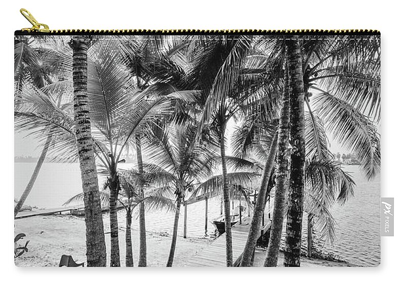Black Zip Pouch featuring the photograph Island Dock Under Palms Black and White by Debra and Dave Vanderlaan