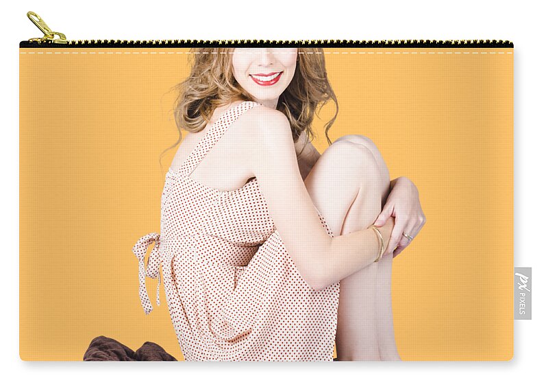 Beauty Zip Pouch featuring the photograph Isolated pinup girl sitting on soft blanket by Jorgo Photography