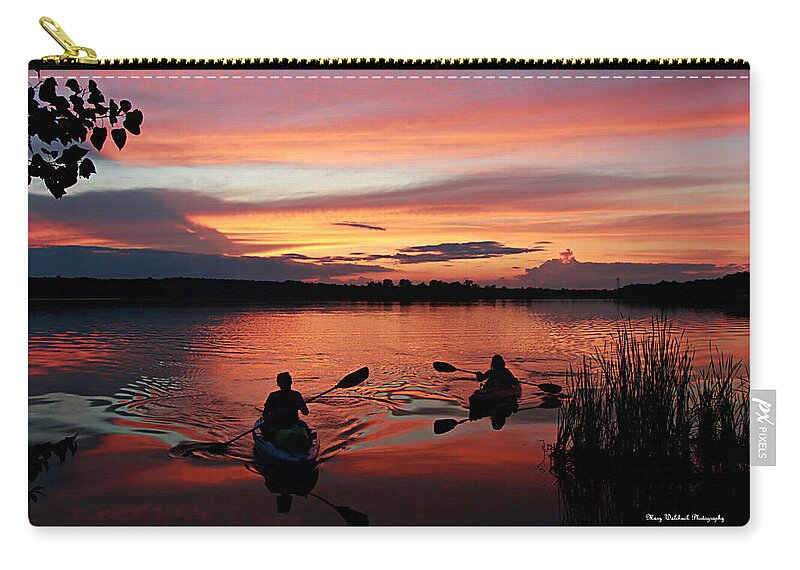 Kayaks At Beautiful Nimisila Reservoir In The City Of Green Carry-all Pouch featuring the photograph Kayaks at Red Sunset by Mary Walchuck
