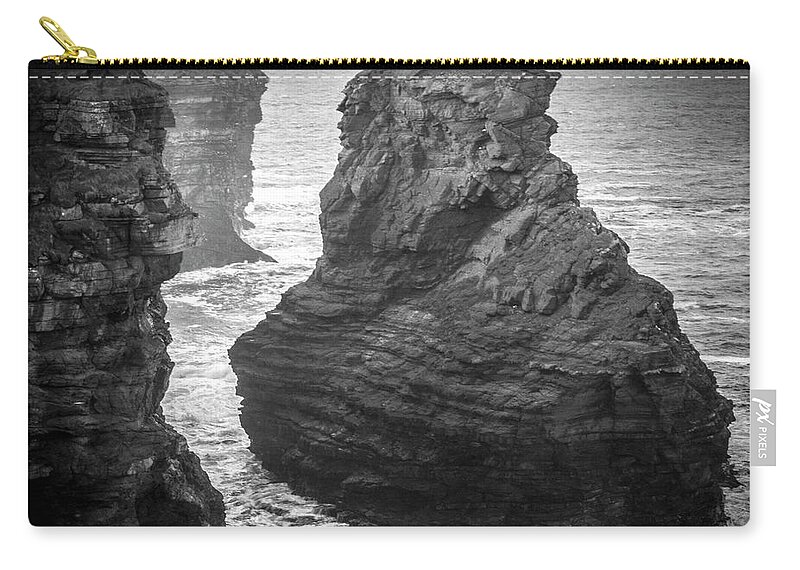 Kilkee Zip Pouch featuring the photograph Kilkee Sea Stack by Mark Callanan