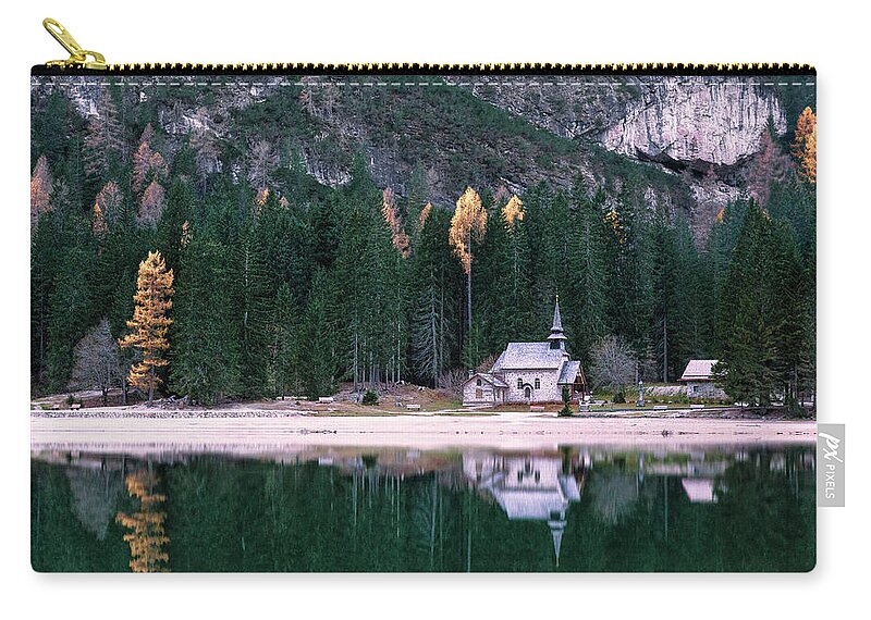 Lago Di Braies Carry-all Pouch featuring the photograph La cappella di lago Braies by Elias Pentikis