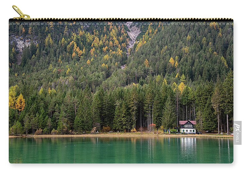 Italy Carry-all Pouch featuring the photograph House in the lake and forest. Lago di dobbiaco lake. Italian aps by Michalakis Ppalis