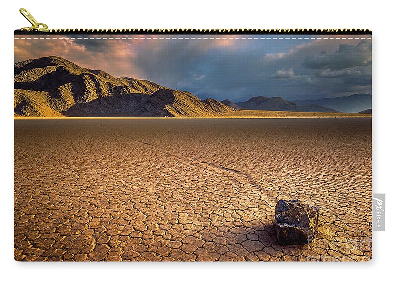 Sliding Rock Zip Pouch featuring the photograph Last light on the Grandstand, Racetrack Playa, Death Valley, California by Neale And Judith Clark