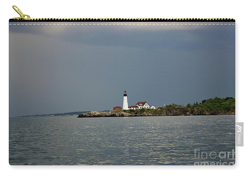 Portland Headlight Zip Pouch featuring the pyrography Lighthouse before the storm by Annamaria Frost