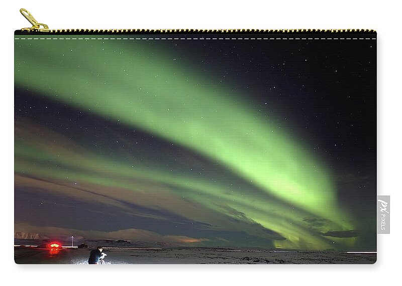 Iceland Zip Pouch featuring the photograph Lights in the snow by Christopher Mathews