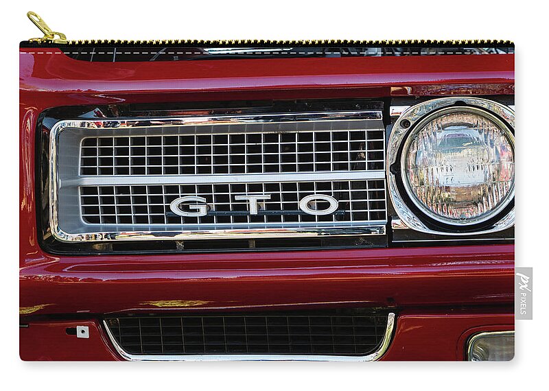 Car Zip Pouch featuring the photograph Little Red GTO by Bonny Puckett