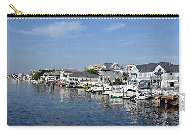 Atlantic Zip Pouch featuring the photograph Luxury homes line a New England waterway by Mark Stout