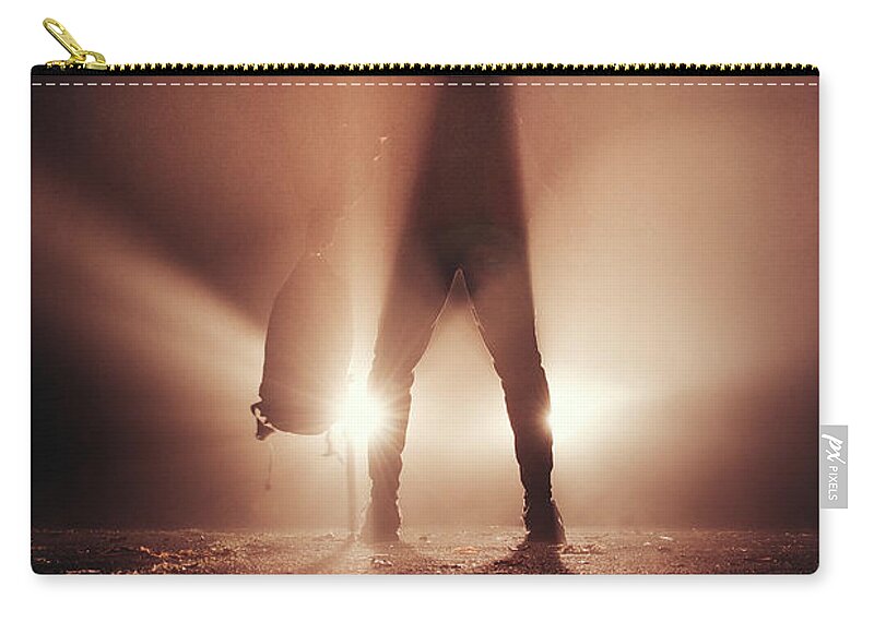 Figure Zip Pouch featuring the photograph Man stands in car lights by Vaclav Sonnek