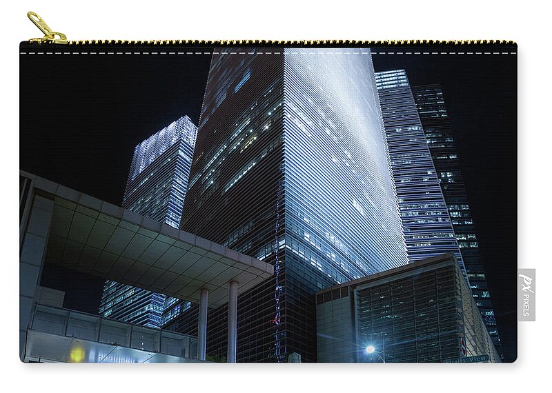 Night Zip Pouch featuring the photograph Marina Bay Financial Centre by Rick Deacon