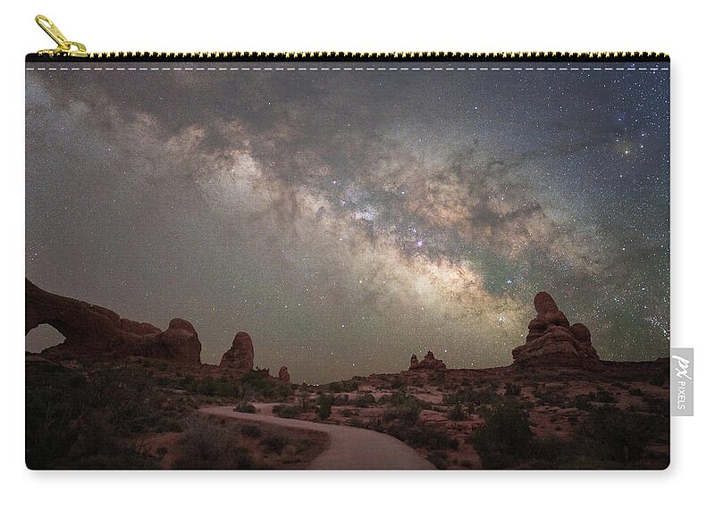 Milky Way Zip Pouch featuring the photograph Milky Way over Arches by Darrell DeRosia