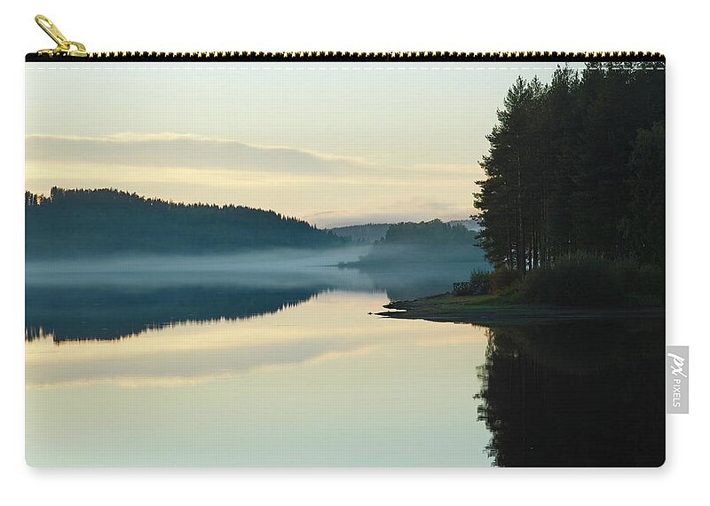 Europe Zip Pouch featuring the photograph Mist is rising over a quiet forest lake at dusk by Ulrich Kunst And Bettina Scheidulin