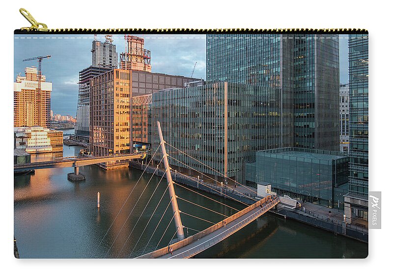 Canary Wharf Zip Pouch featuring the photograph Modern office building in the Canary Wharf financial centre in the evening. London united kingdom by Michalakis Ppalis