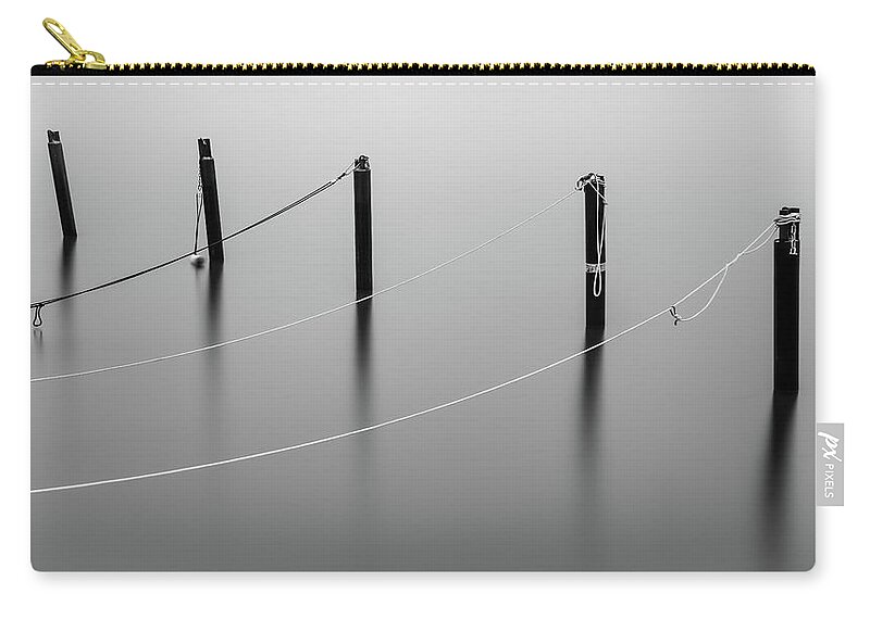 Mooring Zip Pouch featuring the photograph Mooring Poles in Black and White by Nicklas Gustafsson