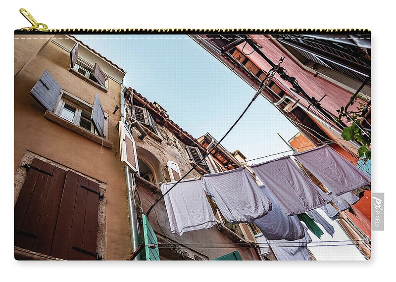 Croatia Zip Pouch featuring the photograph Narrow Alley With Old Houses And Freshly Washed Laundry In The City Of Rovinj In Croatia by Andreas Berthold