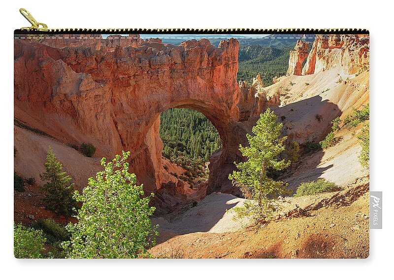 Bryce Zip Pouch featuring the photograph Natural Arch by Aaron Spong