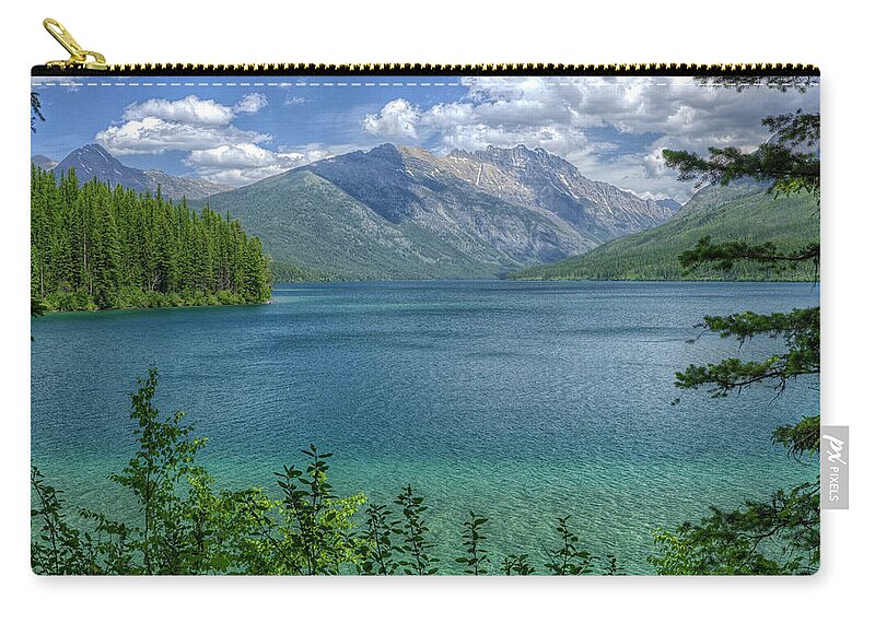 Stunning Kintla Lake In Glacier National Park Zip Pouch featuring the photograph Natures amazing ways by Carolyn Hall