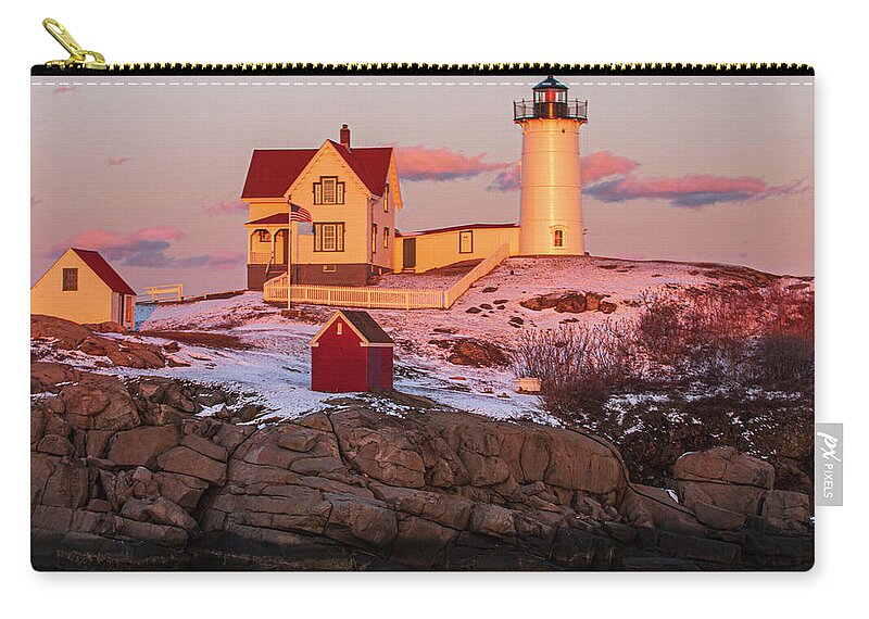 Light Zip Pouch featuring the photograph Nubble Light at Sunset by Paul Mangold