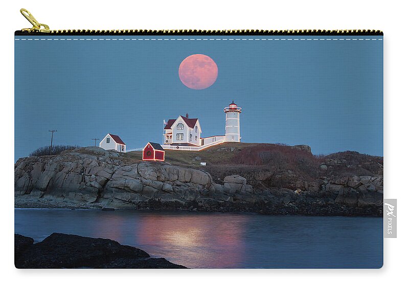 Cape Neddick Zip Pouch featuring the photograph Nubble Lighthouse lit for the season by Jeff Folger
