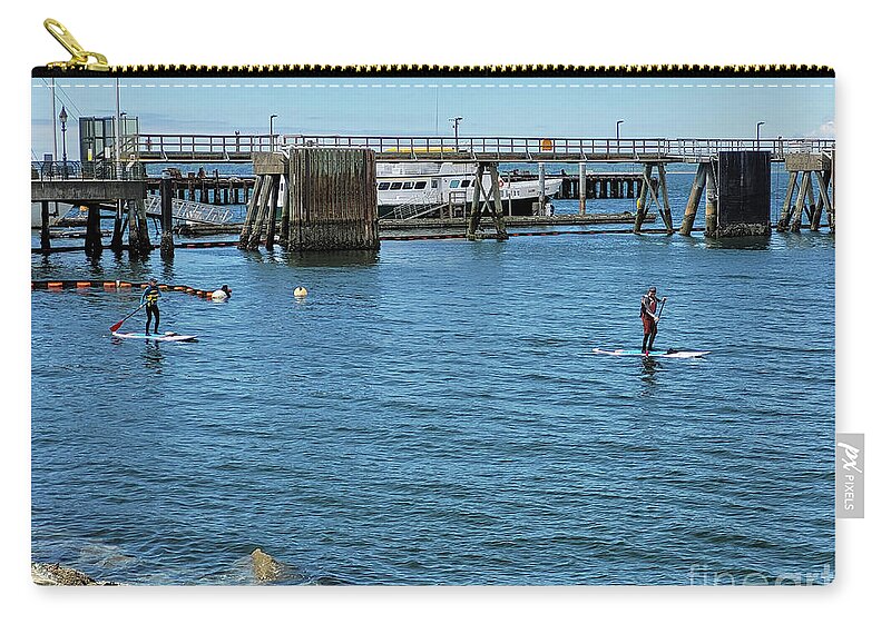 Paddle Boarders By Norma Appleton Zip Pouch featuring the photograph Paddle Boarders by Norma Appleton