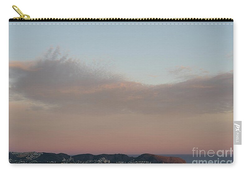 Mediterranean Coast Carry-all Pouch featuring the photograph Pale pink sky and soft clouds at sunset on the Mediterranean coast by Adriana Mueller