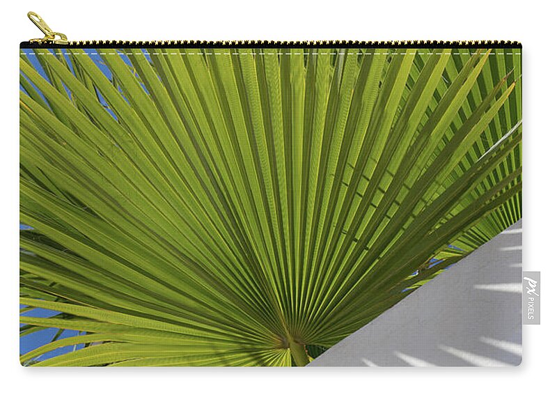 Palm Leaf Carry-all Pouch featuring the photograph Green palm leaves, blue sky and white wall of a modern finca 2 by Adriana Mueller