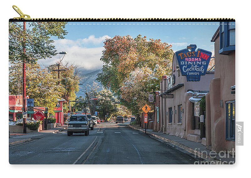 Taos Zip Pouch featuring the photograph Passing the Historic Taos Inn by Elijah Rael