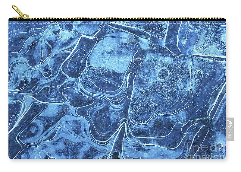 Ice Pattern Zip Pouch featuring the photograph Patterns in the ice of a frozen lake by Neale And Judith Clark