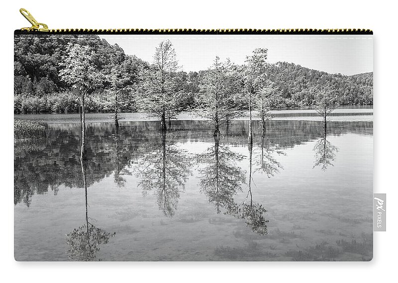 Carolina Zip Pouch featuring the photograph Peaceful Cypress Reflections in Black and White by Debra and Dave Vanderlaan