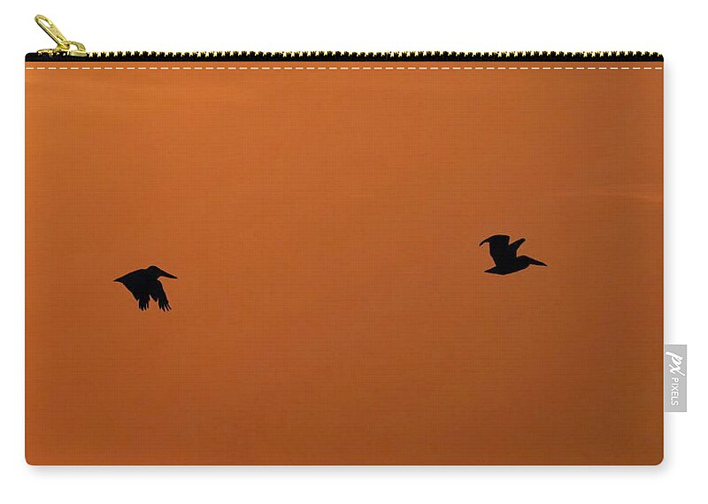 Pelicans Zip Pouch featuring the photograph Pelican's Sunset Flight by Beth Myer Photography