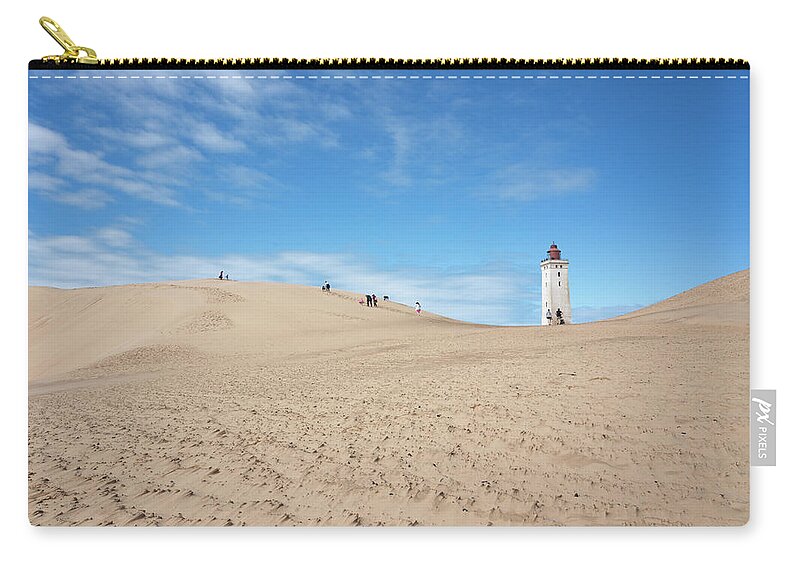 Sand Zip Pouch featuring the photograph Playing in the sand dunes by Anges Van der Logt