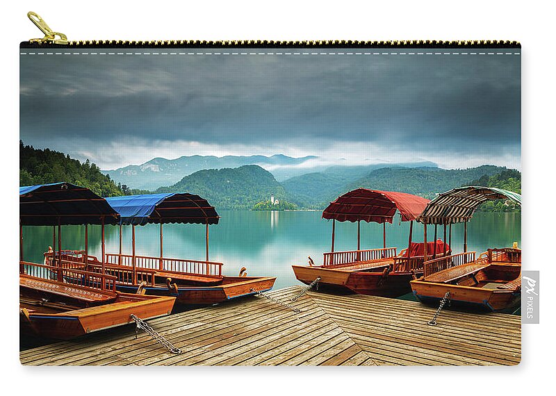 Bled Zip Pouch featuring the photograph Pletna Boats at Lake Bled by Ian Middleton